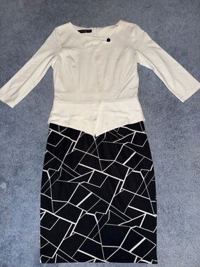 Elegant White Peplum Top & Black Geometric Pencil Skirt Set